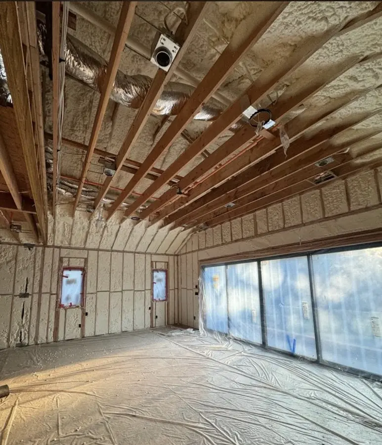 Interior walls and ceiling insulated with spray foam during new construction in Coweta